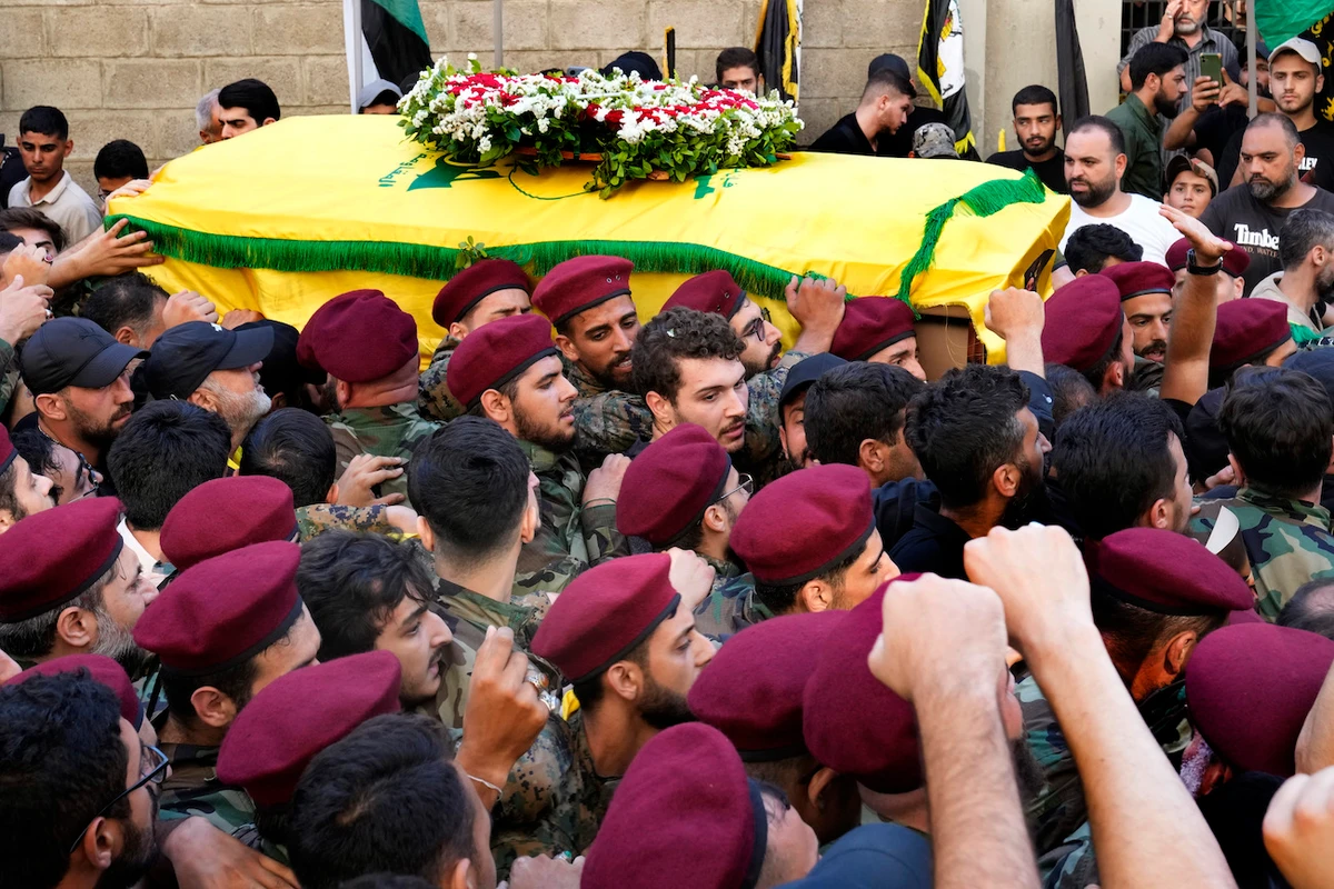 Hezbollah fighters carry the coffin of their top commander Fuad Shuku during his funeral procession in a southern suburb of Beirut, Lebanon, Aug. 1, 2024. (AP)