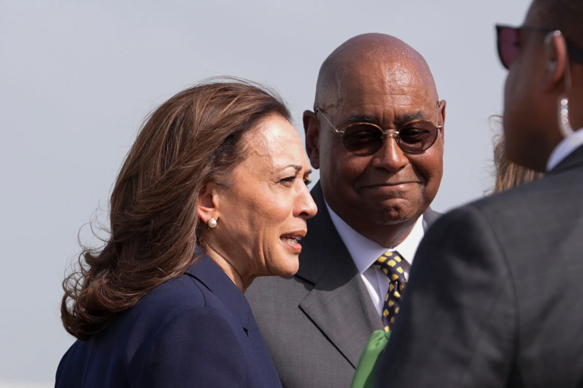 Vice President Kamala Harris, left, is greeted by Harris County Commissioner Rodney Ellis, right, during her arrival at George Bush Intercontinental Airport in Houston, onJuly 31, 2024. (AP)