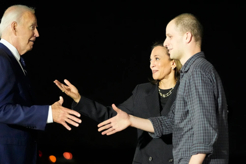 President Joe Biden and Vice President Kamala Harris greet reporter Evan Gershkovich at Andrews Air Force Base following his release as part of a 24-person prisoner swap between Russia and the United States on Aug. 1, 2024. (AP)