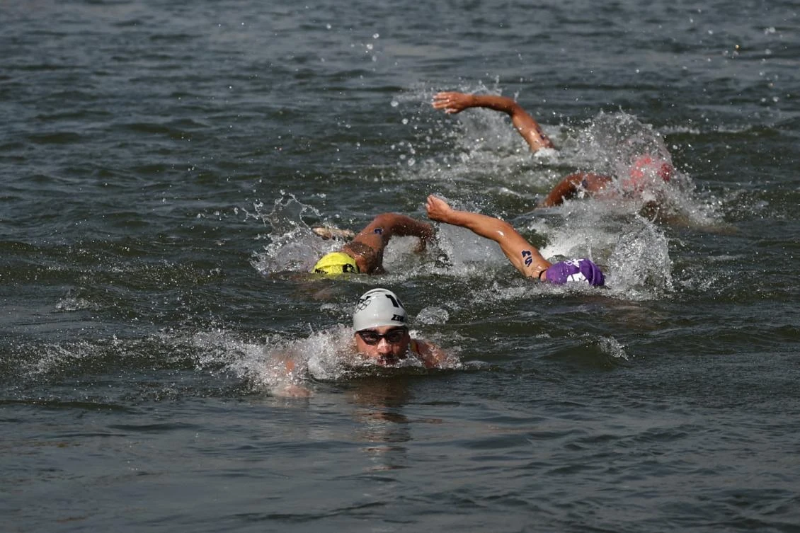 Athletes compete in the swimming stage in the Seine during the men's individual triathlon at the Paris 2024 Olympic Games in central Paris on July 31, 2024. (AFP)