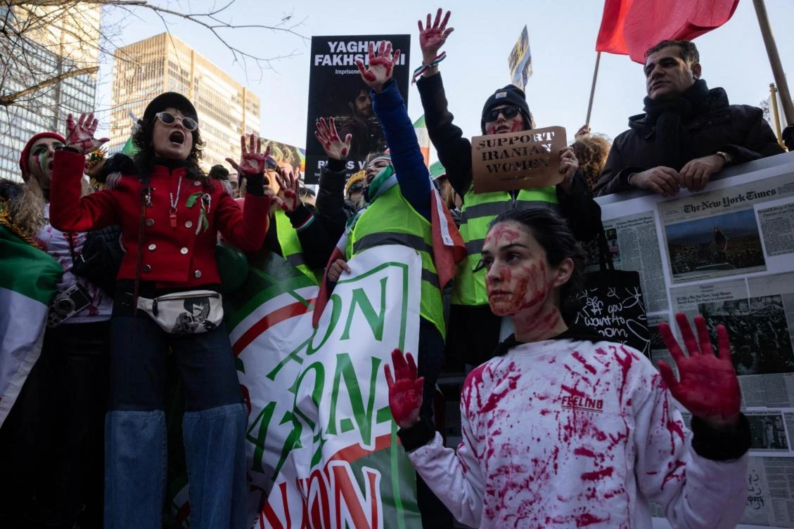 Naz Gharai, from Tehran, is covered in red paint as protesters call on the United Nations to take action against the treatment of women in Iran, following the death of Mahsa Amini while in the custody of the morality police, during a demonstration near UN headquarters in New York City on November 19, 2022. (File/AFP)