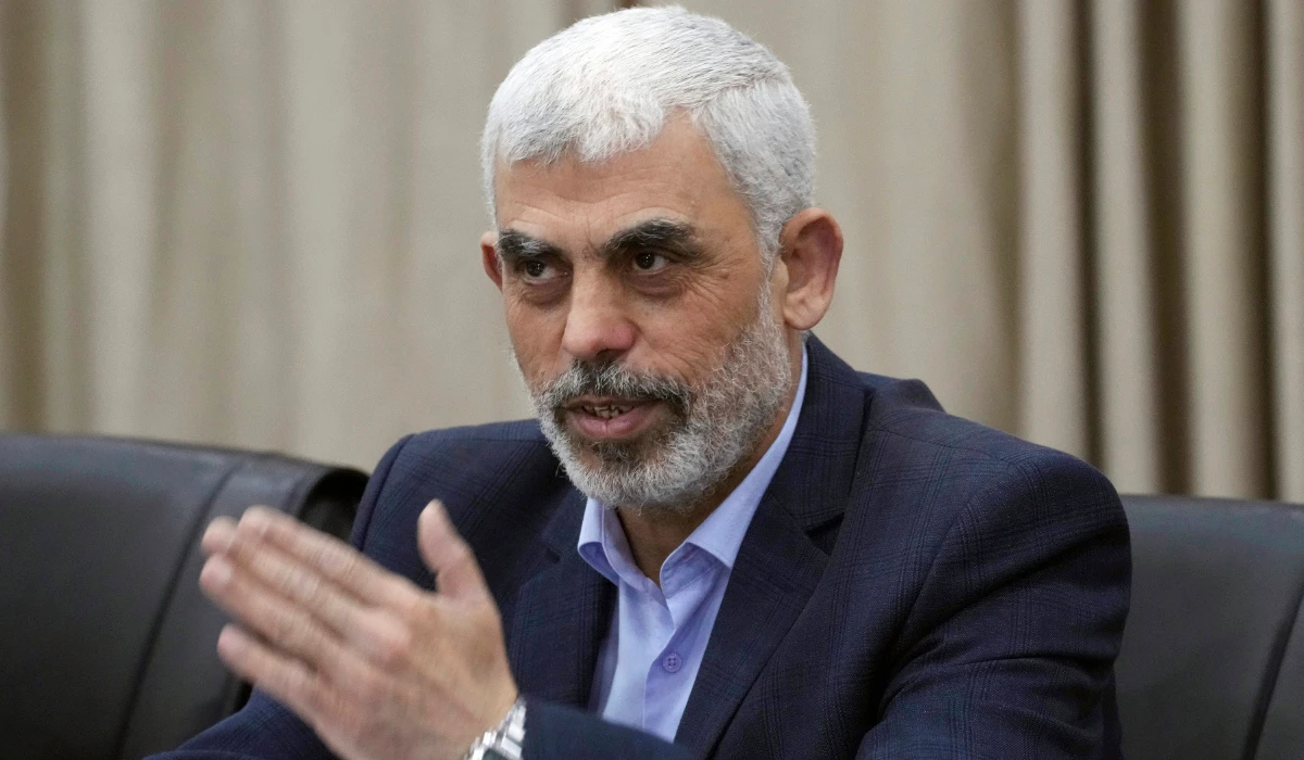 Yehia Sinwar, head of Hamas in Gaza, greets his supporters during a meeting with leaders of Palestinian factions at his office in Gaza City, Wednesday, April 13, 2022. (AP)