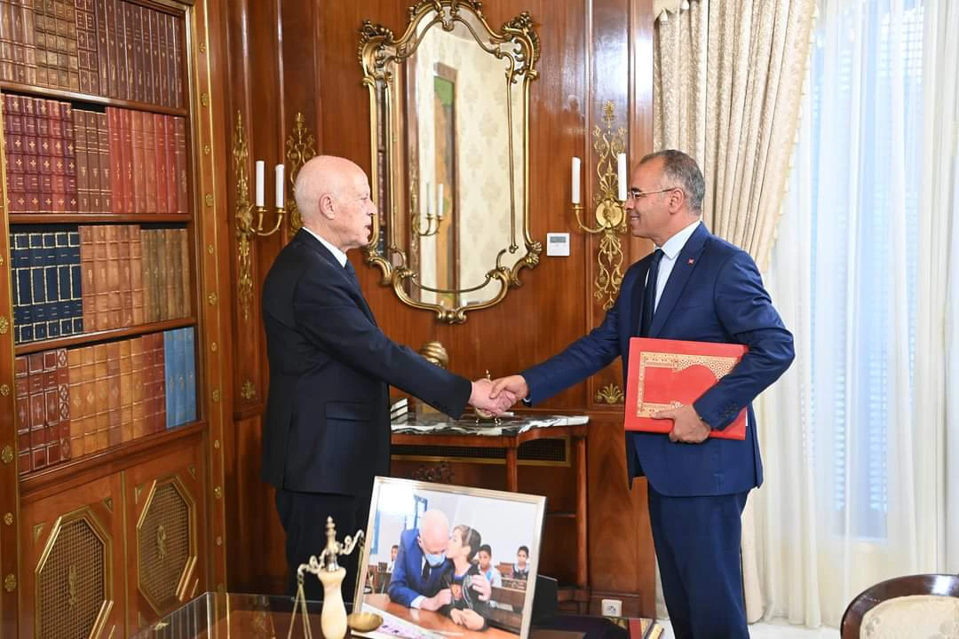 Tunisian President Kais Saied (left) meeting with newly appointed Prime Minister Kamel Maddouri at the Kasbah Palace in Tunis on Aug. 7, 2024. (X: @TapNewsAgency)