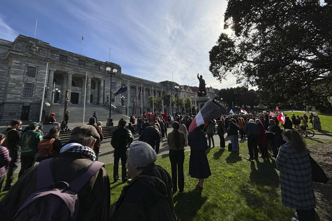 Protesters gathered outside Parliament in this week to oppose the government’s plans to repeal a clause requiring recognition of children’s Maori heritage from the law governing the child protection system. (AP)