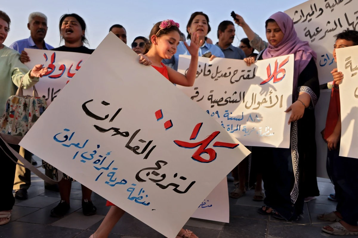 Activists demonstrate against female child marriages in Tahrir Square in central Baghdad on July 28, 2024, amid parliamentary discussion over a proposed amendment to the Iraqi Personal Status Law (AFP)