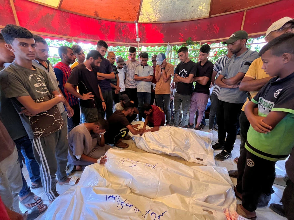 Mourners react as they gather around the bodies of Palestinians killed in Israeli strikes, amid Israel-Hamas conflict, at Nasser hospital in Khan Younis in the southern Gaza Strip (REUTERS)