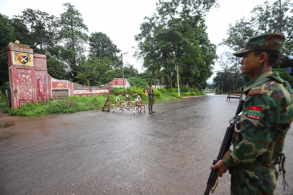 Above, members of the ethnic armed group Ta’ang National Liberation Army stand guard at a checkpoint in the town of Kyaukme in Myanmar’s northern Shan State. (AFP)