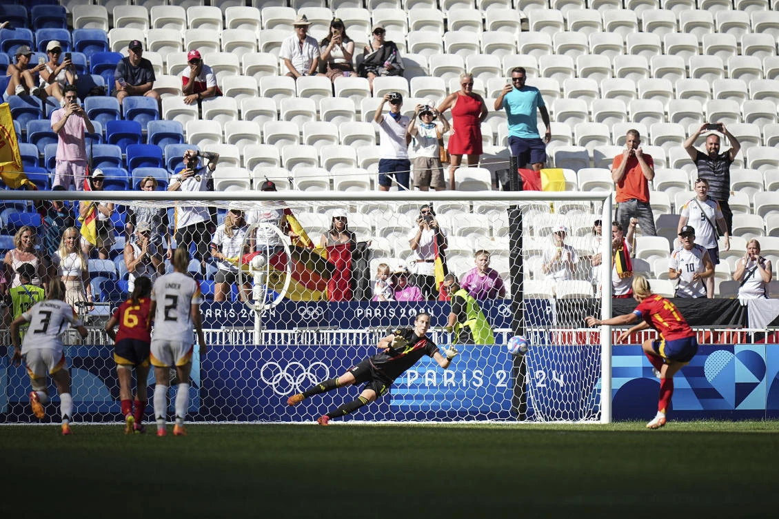 Germany’s goalkeeper Ann-Katrin Berger stops a penalty by Spain’s Alexia Putellas, right, during the women’s bronze medal soccer match at the Lyon stadium, during the 2024 Summer Olympics, on Aug. 9, 2024, in Decines, France. (AP)
