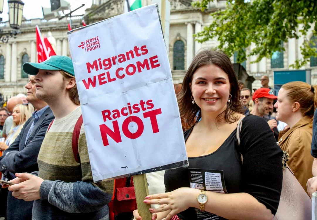 Protestors attend a "unity over division" protest called to oppose an anti-immigration demonstration in Belfast Northern Ireland on August 9, 2024. (AFP)