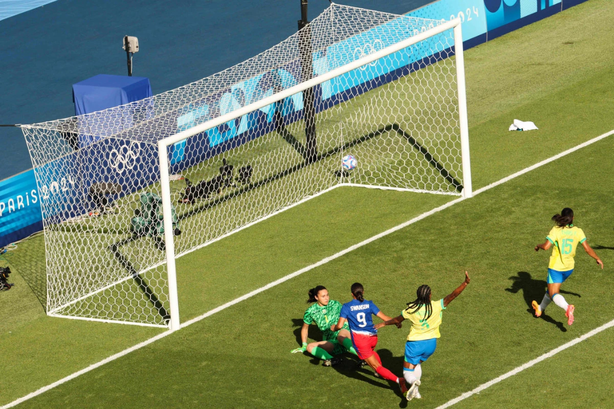 US forward Mallory Swanson scores the opening goal in the women's gold medal final football match between Brazil and US during the Paris 2024 Olympic Games at the Parc des Princes in Paris on August 10, 2024. (AFP)