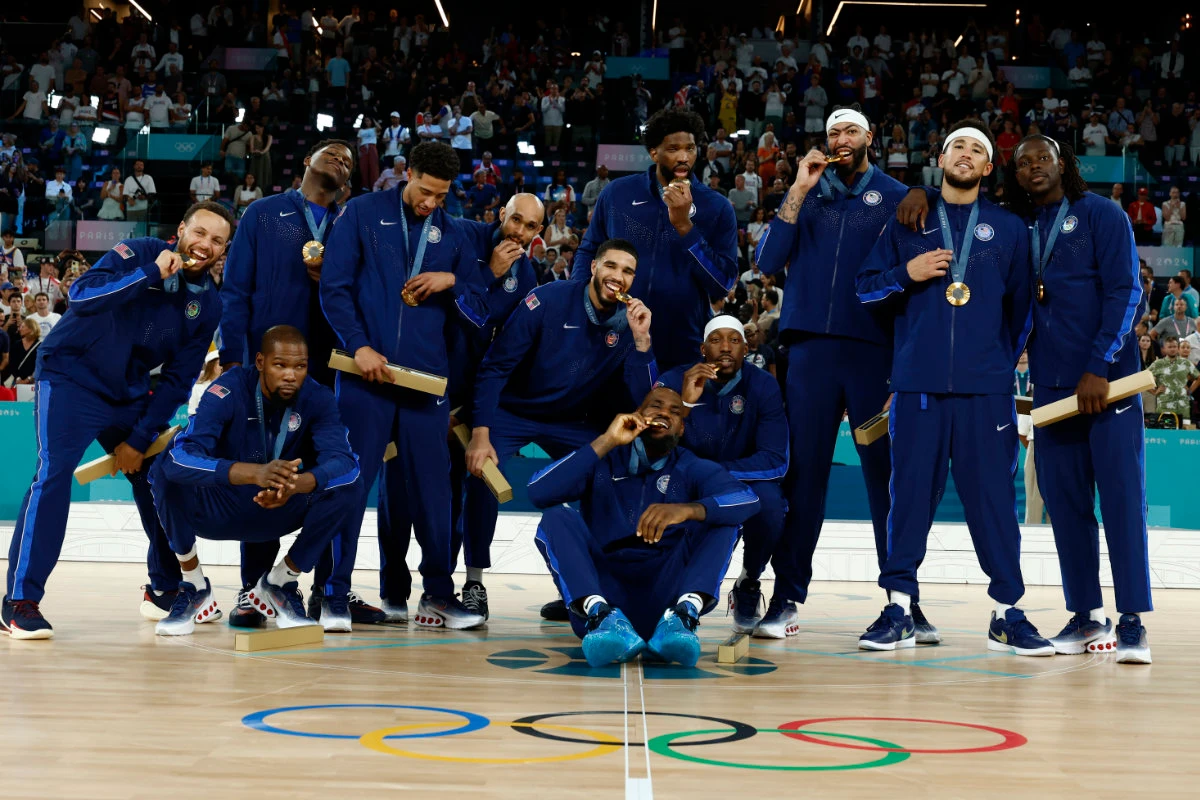 US players celebrate after receiving their gold medals in the Paris 2024 Olympics men's basketball at Bercy Arena in Paris on August 10, 2024. (REUTERS)