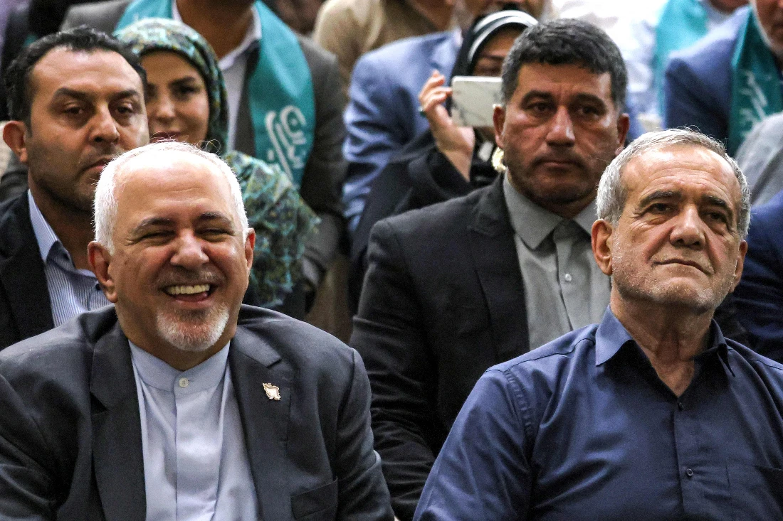 Iran's newly-elected President Masoud Pezeshkian (R) and former foreign minister Mohammad Javad Zarif (L) visit the shrine of the Islamic Republic's founder Ayatollah Ruhollah Khomeini in the south of Tehran. (File/AFP)