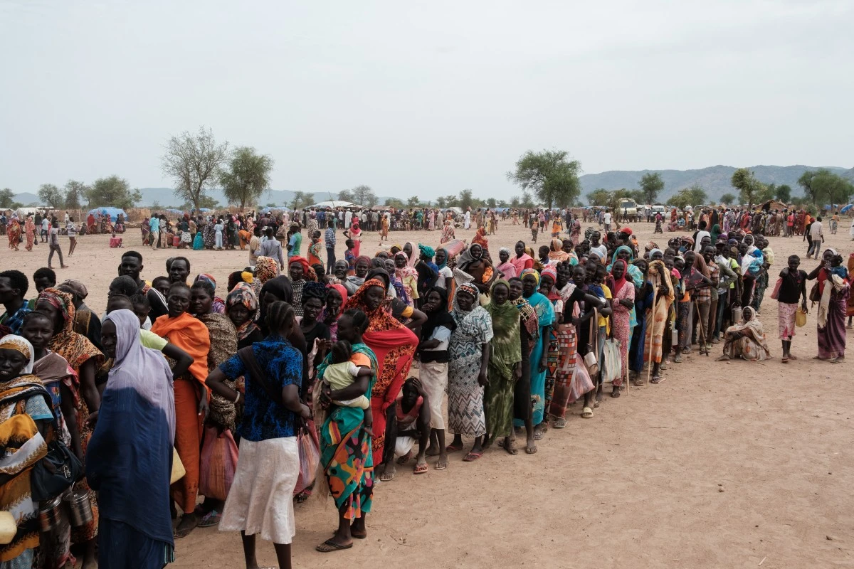 People line up to register for a potential food aid delivery at a camp for internally displaced persons (IDP) in Agari, South Kordofan, on June 17, 2024. (AFP)