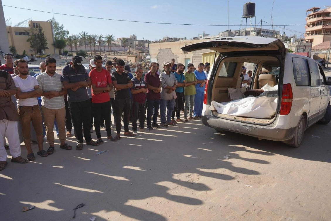 Palestinians attend the funeral of members of the Najjar family, killed in an Israeli strike, in Khan Yunis in the southern Gaza Strip on August 12, 2024. (AFP)