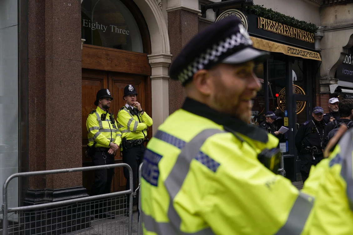 Police officers patrol outside the London offices of the political party Reform UK, ahead of an anti-far right protest, in London, Saturday, Aug. 10, 2024. (AP)