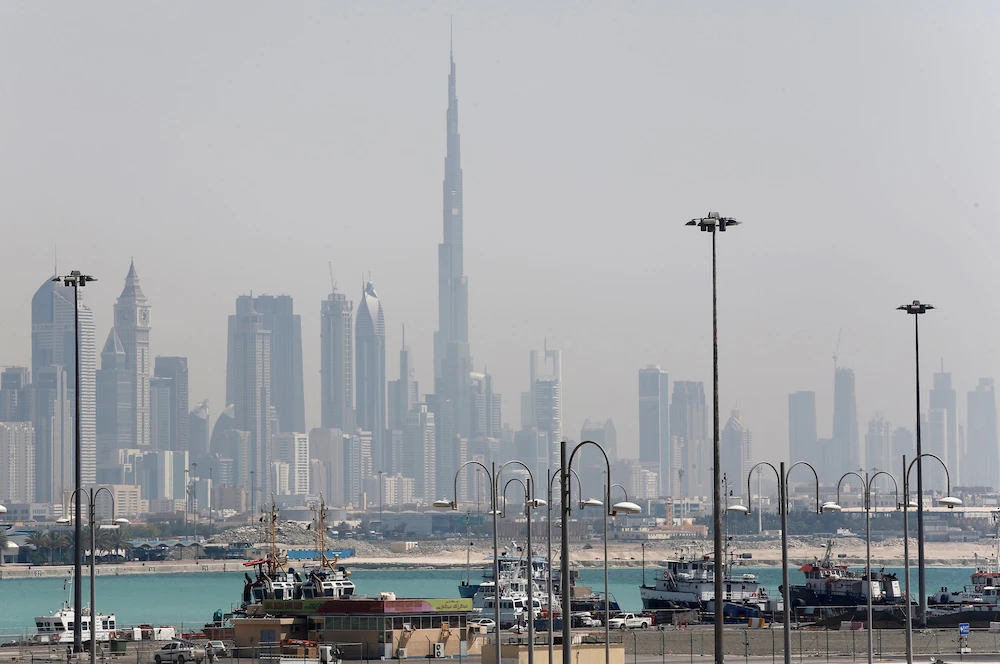 The skyline is seen with the Burj Khalifa as ships dock at Port Rashid, in Dubai. File/Reuters