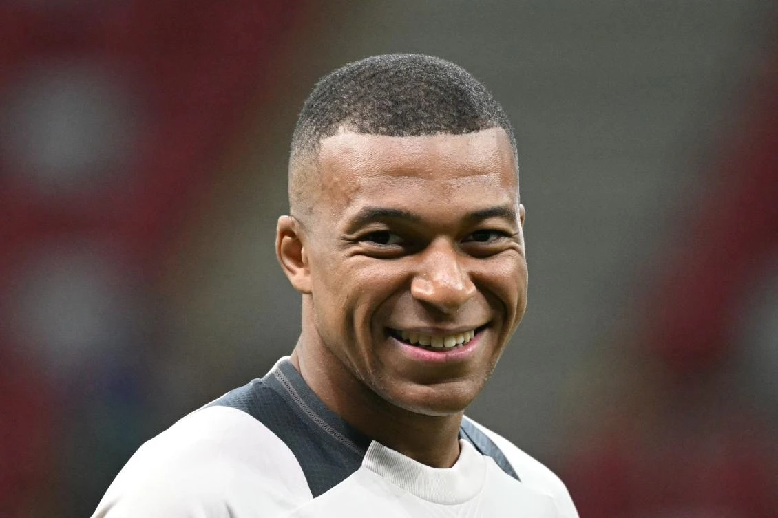 Real Madrid’s French forward Kylian Mbappe reacts as he attends a training session on the eve of the UEFA Super Cup football match Real Madrid v Atalanta Bergamo in Warsaw on Aug. 13, 2024. (AFP)