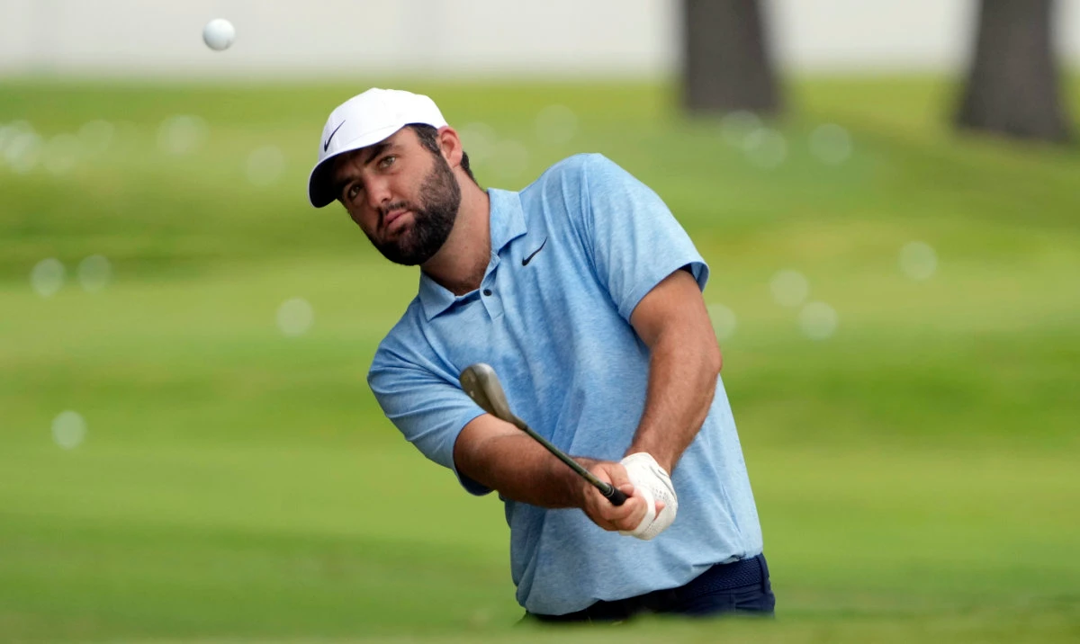 Scottie Scheffler hits onto a practice green at the St. Jude Championship golf tournament Wednesday in Memphis, Tenn. The tournament is scheduled to begin Thursday. (AP)
