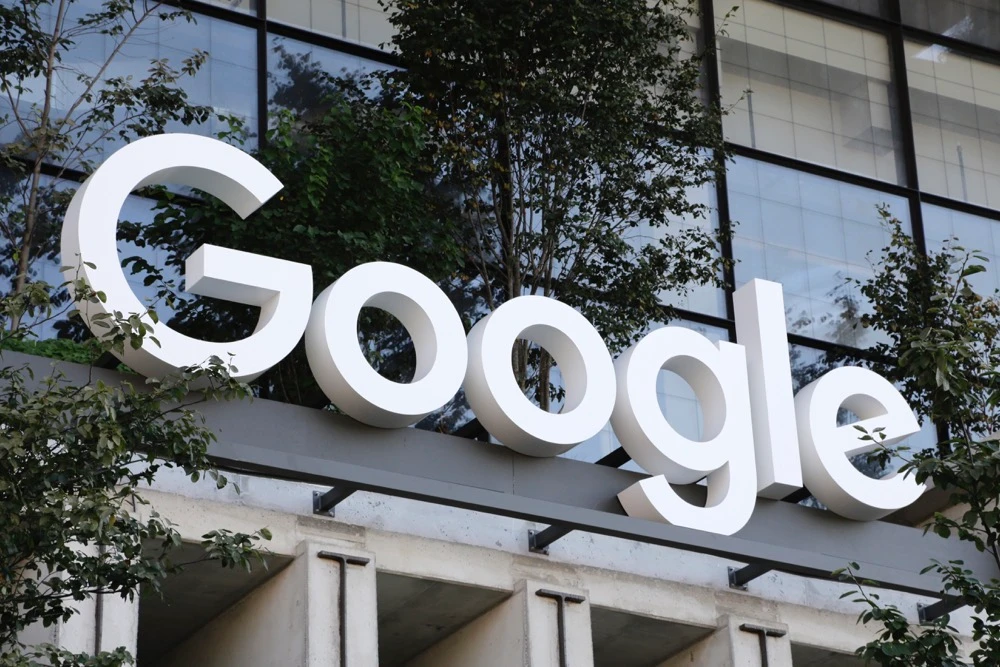 Google sign hangs over an entrance to the company's new building. (AP)