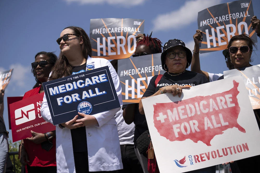 Above, supporters during Senator Bernie Sanders’ news conference announcing the re-introduction of the Medicare For All Act of 2023 outside the US Capitol on May 17, 2023. (Getty Images via AFP)