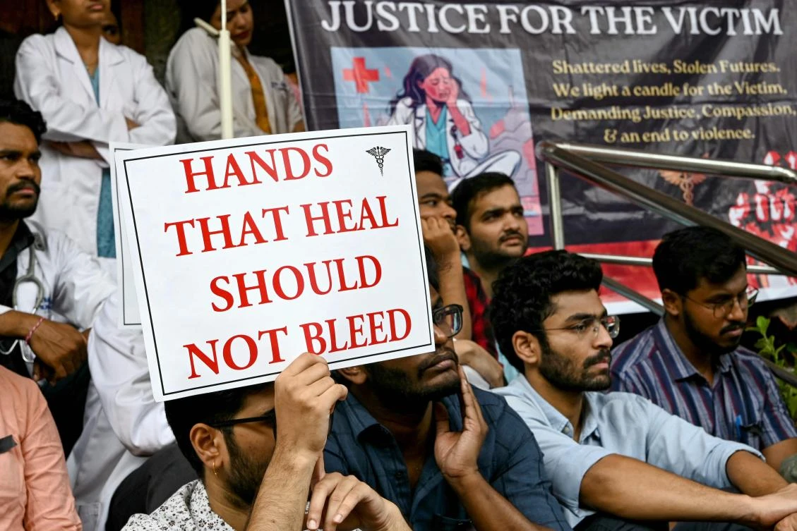 Doctors hold posters as they strike to protest the rape and murder of a young medic from Kolkata, at the Gandhi Hospital in Hyderabad on August 14, 2024. (AFP)