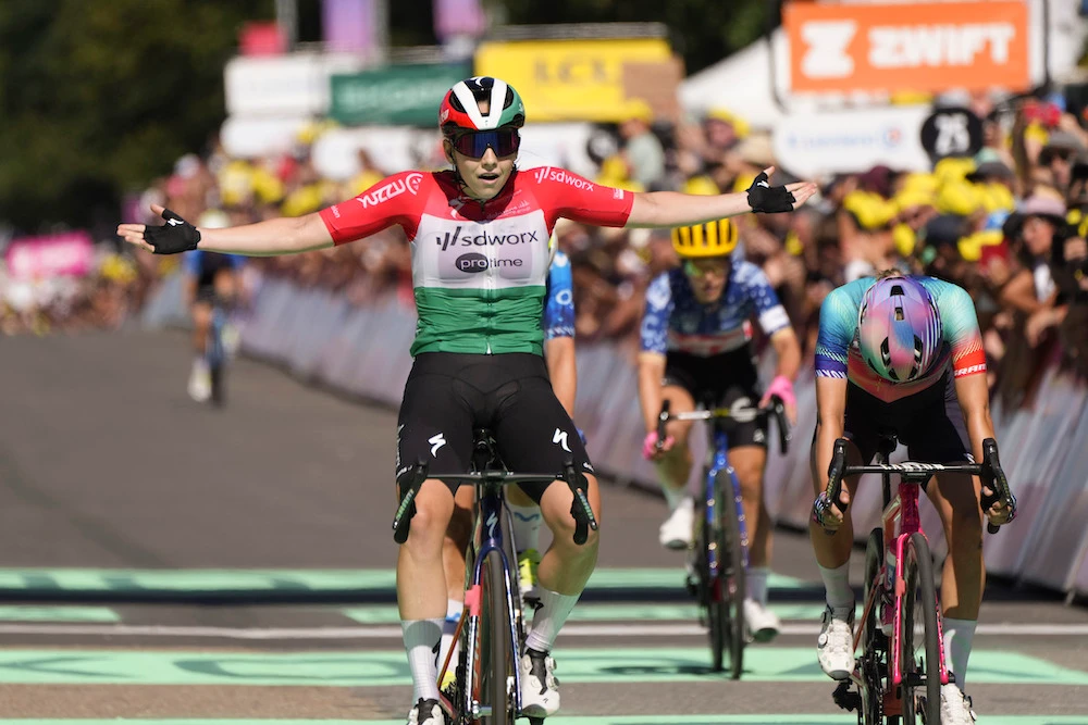 Blanka Vas of Hungary celebrates as she crosses the finish line to win the fifth stage of the Tour de France Women cycling race with start in Bastogne, Belgium and finish in Amneville, France, Thursday. (AP)