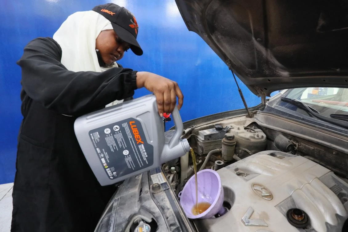 Sudanese mechanic Asawar Mustafa works on a car in the women-only section of a garage in the northwestern Libyan city of Misrata, on July 31, 2024.(AFP)