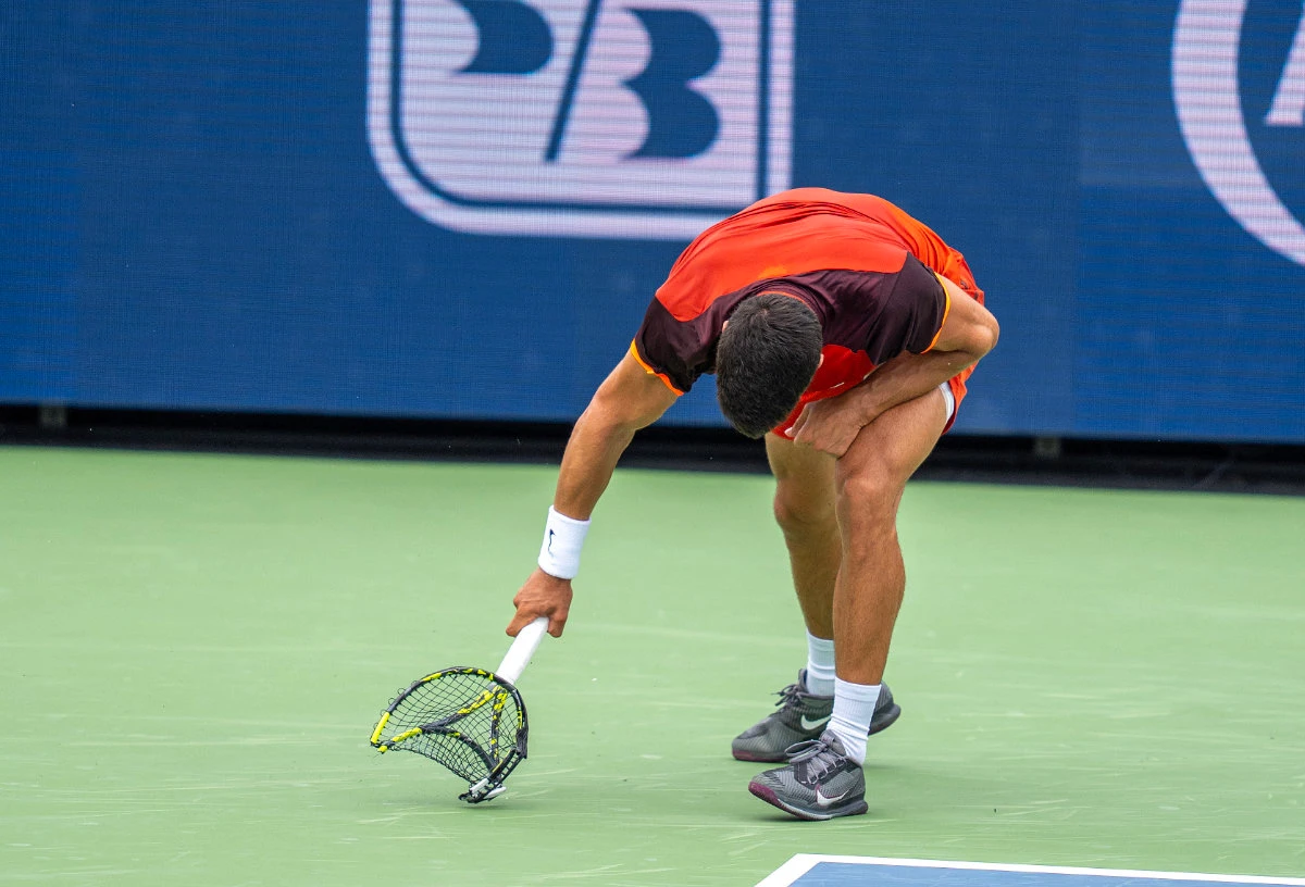 Carlos Alcaraz of Spain smashes his racket during his match against Gael Monfils of France on Day 5 of the Cincinnati Open on Friday. (USA TODAY Sports)