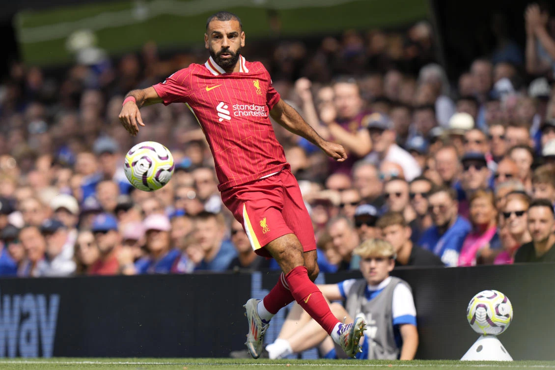 Liverpool's Mohamed Salah controls the ball during the English Premier League soccer match between Ipswich Town and Liverpool at Portman Road stadium in Ipswich, England. (AP)