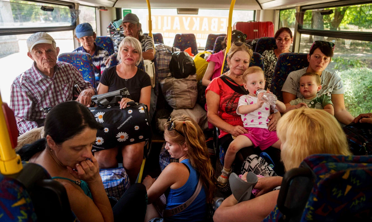People sit in a bus during evacuation in Pokrovsk, Donetsk region, Ukraine, Monday, August 19, 2024. (AP)