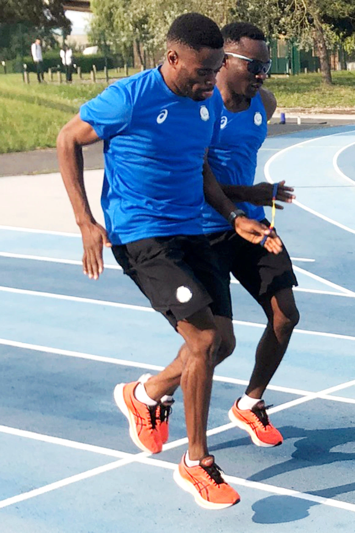 Donard Ndim Nyamjua, left, guide for sprinter Guillaume Junior Atangana, right, a member of the Refugee Paralympic Team, during training camp, ahead of the Paralympic Games Monday in Reims, eastern France. (AP)