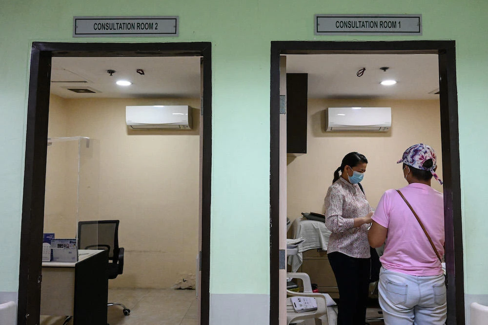 The first mpox patient reported by the Philippines this year remains confined in a hospital, health authorities say. Above, patients queue for consultation at a hospital in Quezon City. (AFP file photo)