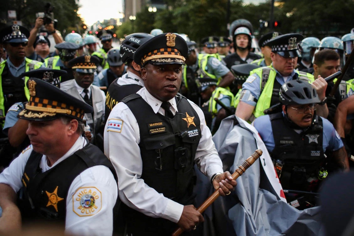 Police clash with demonstrators during a protest at the Israeli consulate during the Democratic National Convention on August 20, 2024 in Chicago, Illinois. (AFP)