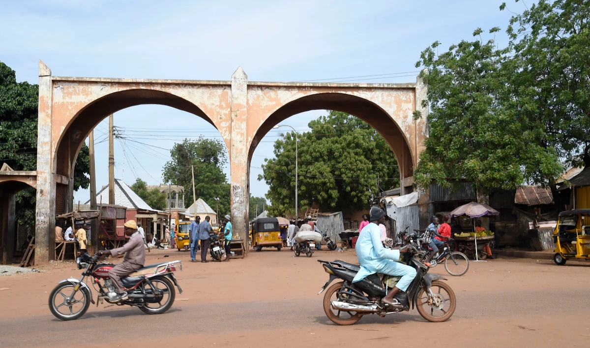 Motor bike riders drive past Kofar Kade, a city gate in ancient Sokoto, northwest Nigeria on September 21, 2021. (AFP/File)