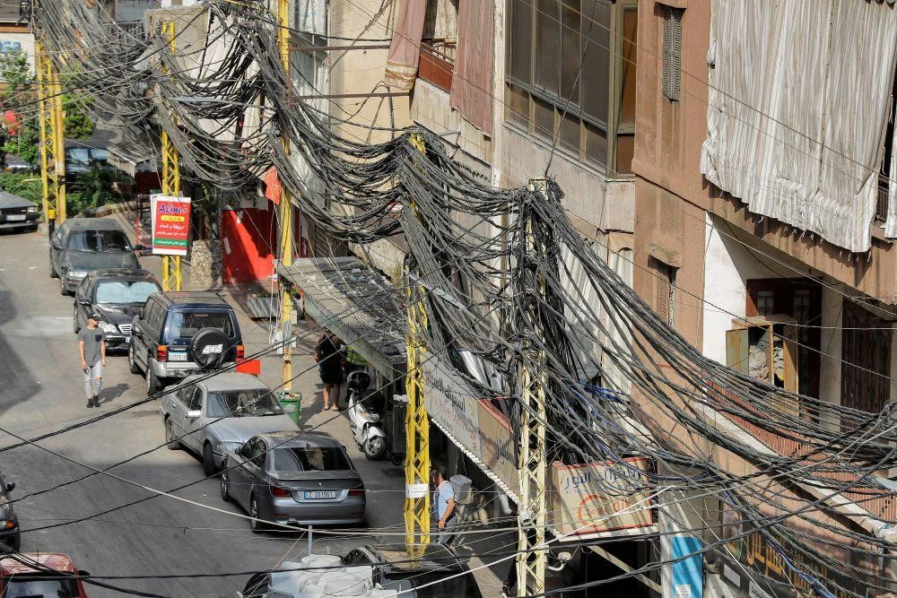 With the national network prone to blackouts, many Lebanese pay a separate bill for a backup from neighborhood generators run by private firms. (AFP)