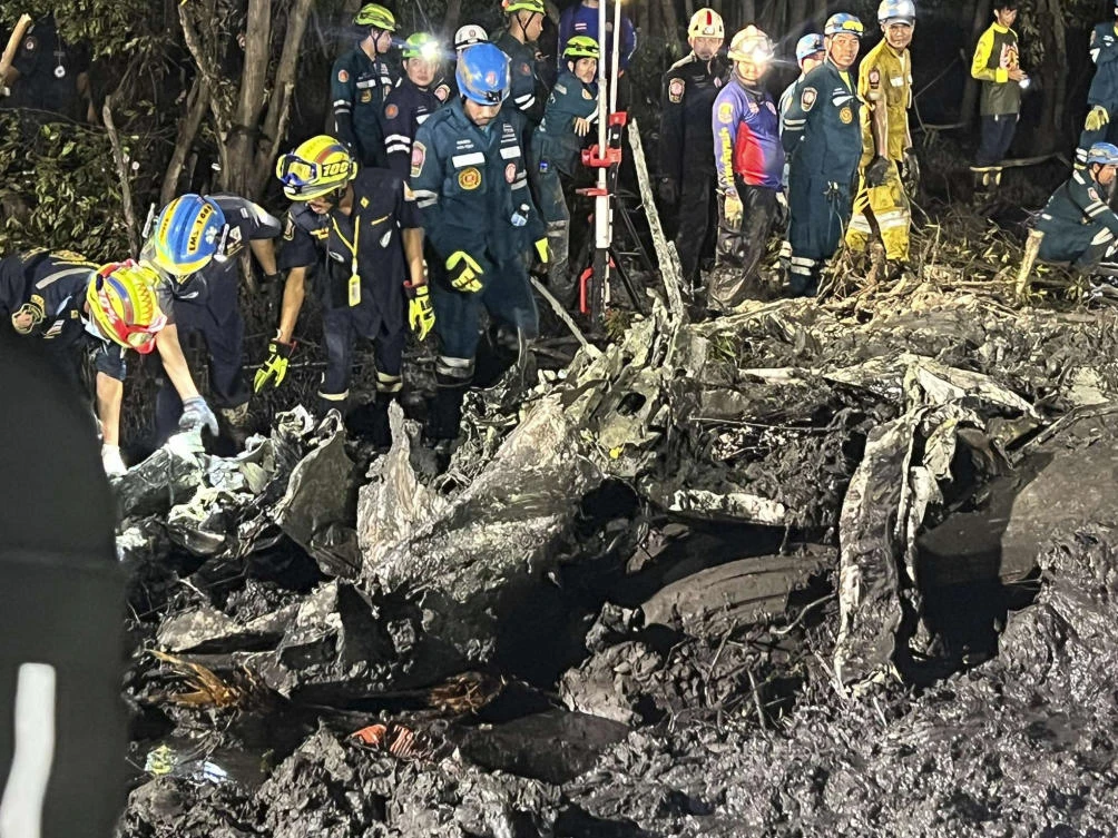 A rescue team works at a site of a small aircraft’s crash in Chachoengsao province, Thailand on Aug. 22, 2024. (Chachoengsao’s Public Relations Department via AP)