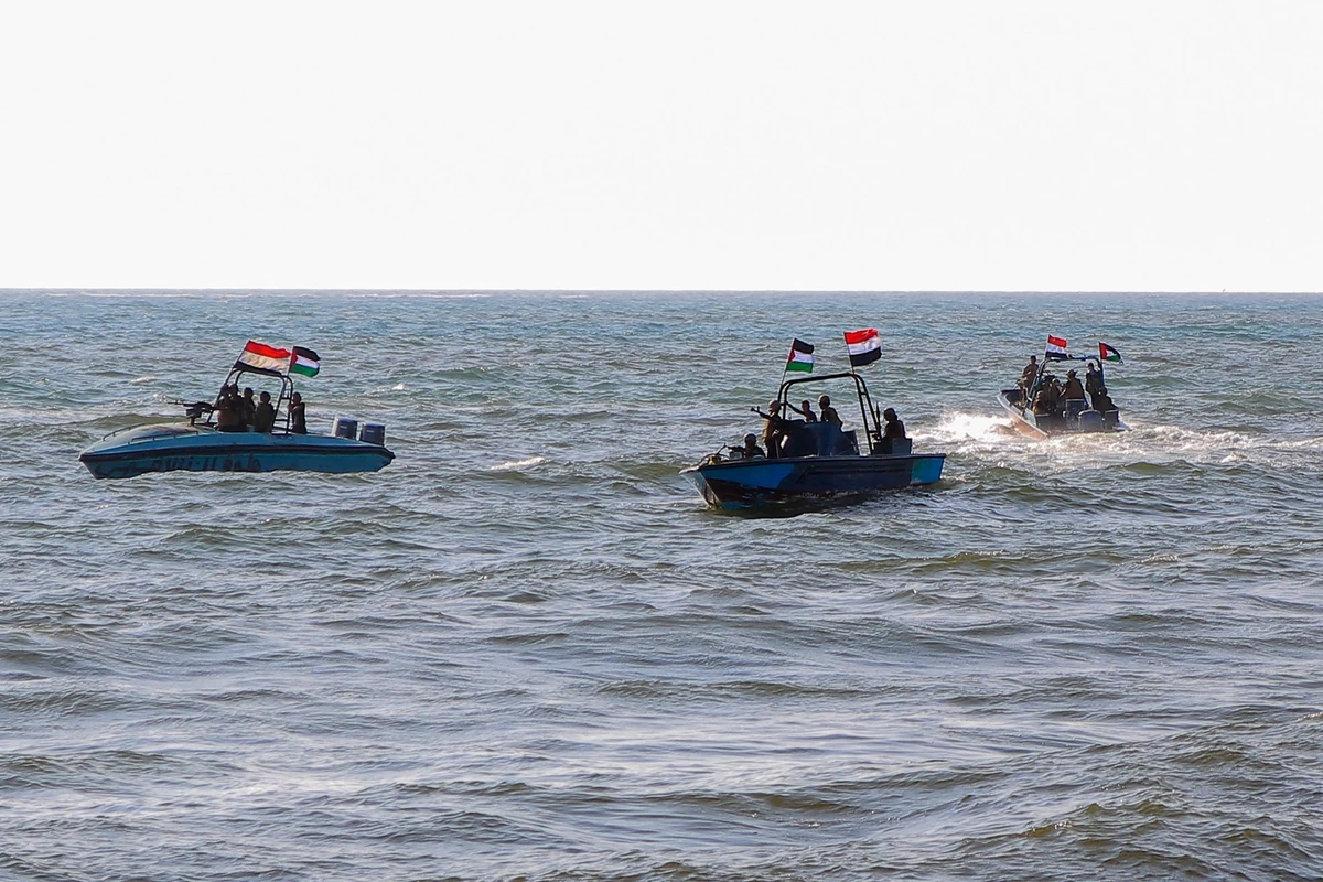 Members of the Yemeni Coast Guard affiliated with the Houthi group patrol the sea as demonstrators march through the Red Sea port city of Hodeida in solidarity with the people of Gaza on January 4, 2024(AFP)