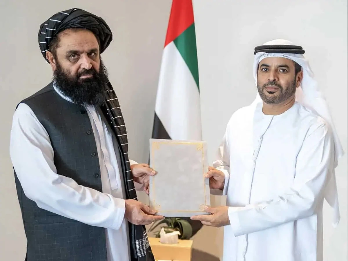 Mawlawi Badruddin Haqqani (left), Ambassador of the Islamic Emirate of Afghanistan to the United Arab Emirates, hands over a copy of his credentials to Assistant Undersecretary for Protocol at the Ministry of Foreign Affairs, Saif Abdullah Al-Shamsi, during a ceremony at the Ministry of Foreign Affairs of the United Arab Emirates on August 21, 2024. (@MoFA_Afg/X)