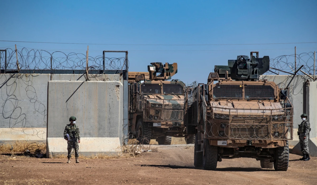 Turkish military vehicles enter Syria to take part in a joint patrol with Russian troops, in the countryside of the town of Derbassiye in Syria's northeastern Hasakeh province, on the border with Turkey, on July 14, 2021. (AFP)