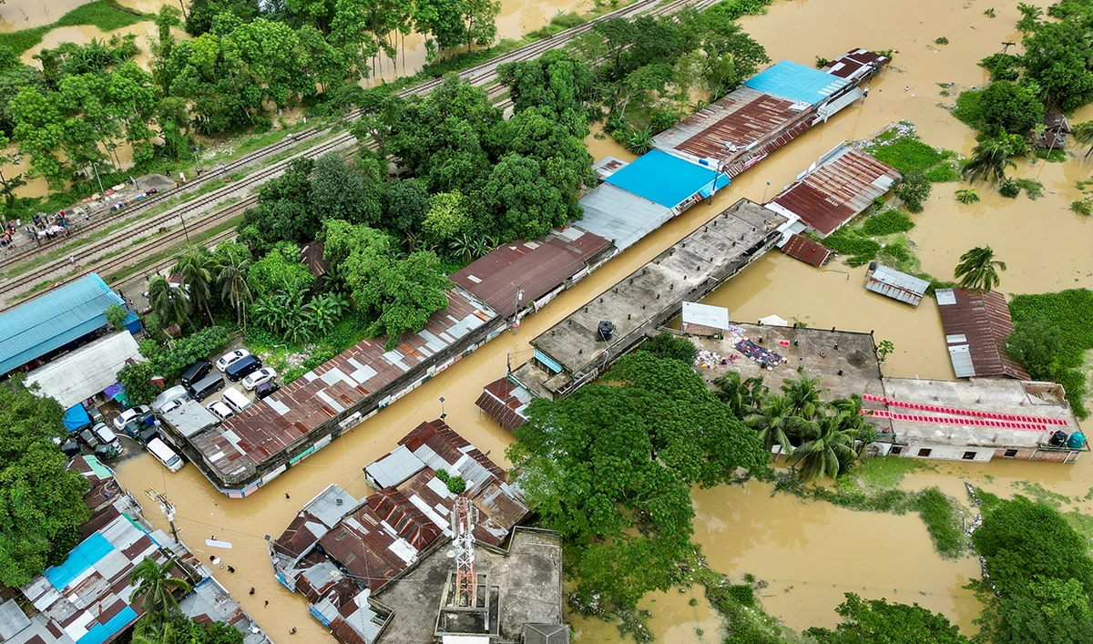An aerial view shows partially submerged houses after flood in Feni on August 24, 2024. (AFP)