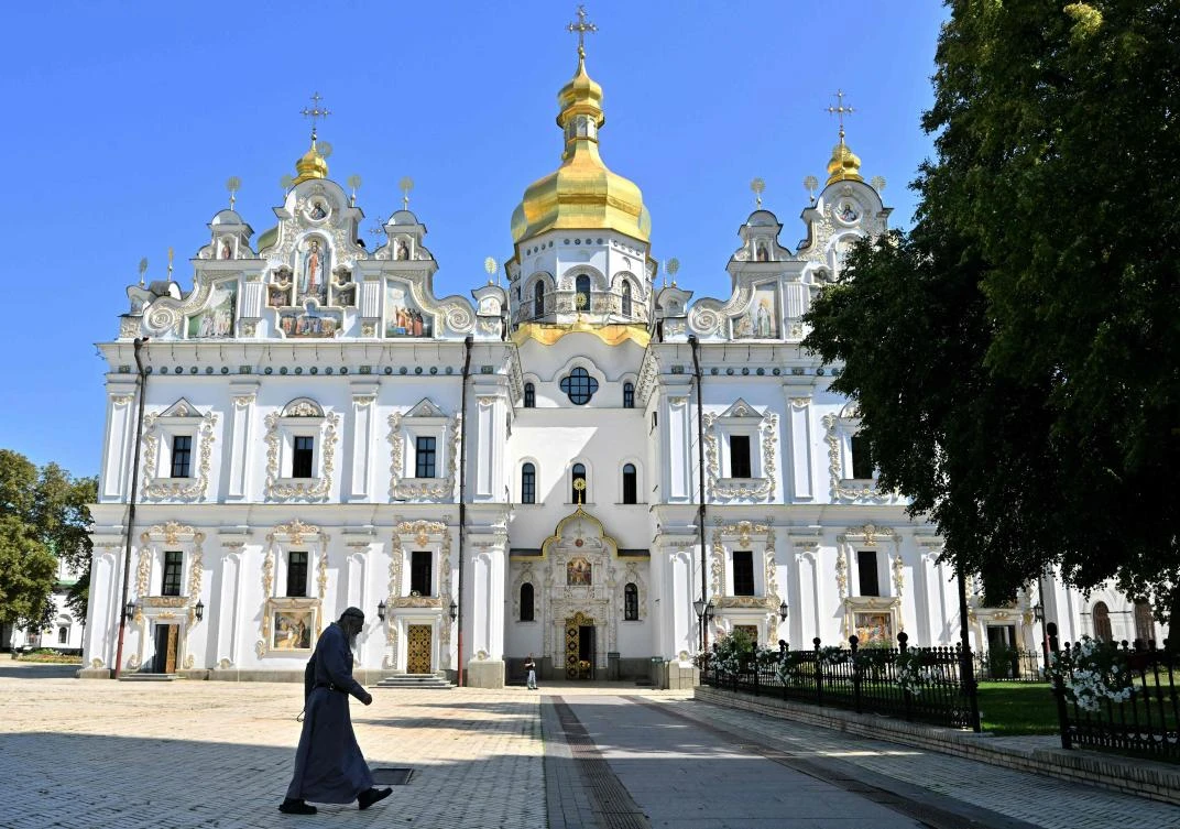 A monk walks past the Uspenskyi cathedral at Kyiv Pechersk Lavra in Kyiv on August 20, 2024. (AFP)