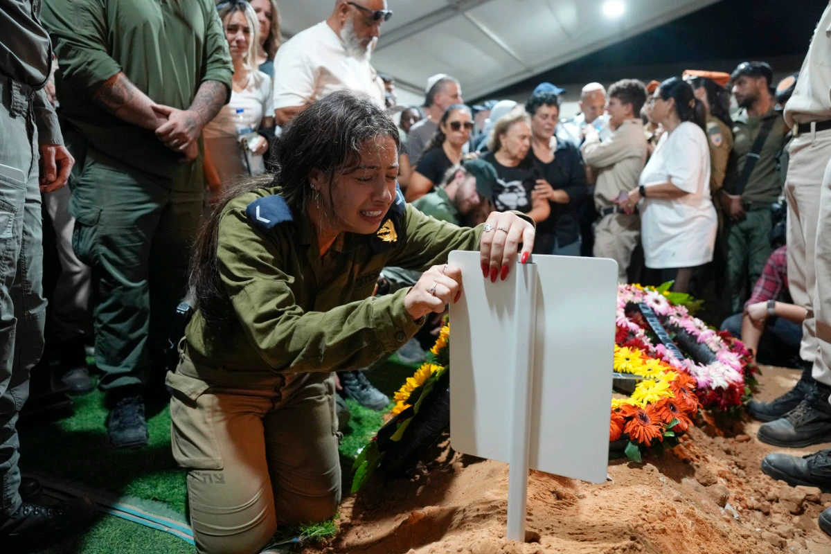 The sister of Petty Officer 1st Class David Moshe Ben Shitrit, who was killed on a Hezbollah attack, mourns during his funeral at the Mount Herzl military cemetery in Jerusalem on Aug. 25, 2024. (AP)