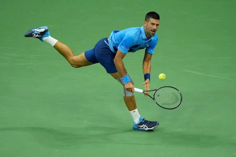 Novak Djokovic, of Serbia, returns a shot to Radu Albot, of Moldova, during a first round match of the US Open tennis championships Monday in New York. (AP)