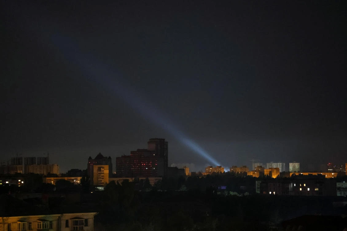 Ukrainian service personnel use a searchlight as they search for drones in the sky over the city during a Russian drone strike, amid Russia's attack on Ukraine, in Kyiv, Ukraine August 27, 2024. (Reuters)