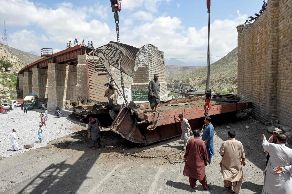 Pakistan railway track hangs off bridge after attacks