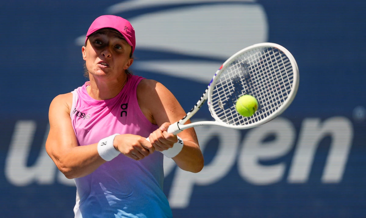 Iga Swiatek, of Poland, returns a shot to Kamilla Rakhimova, during the first round of the U.S. Open tennis championships, Tuesday, Aug. 27, 2024, in New York. (AP)