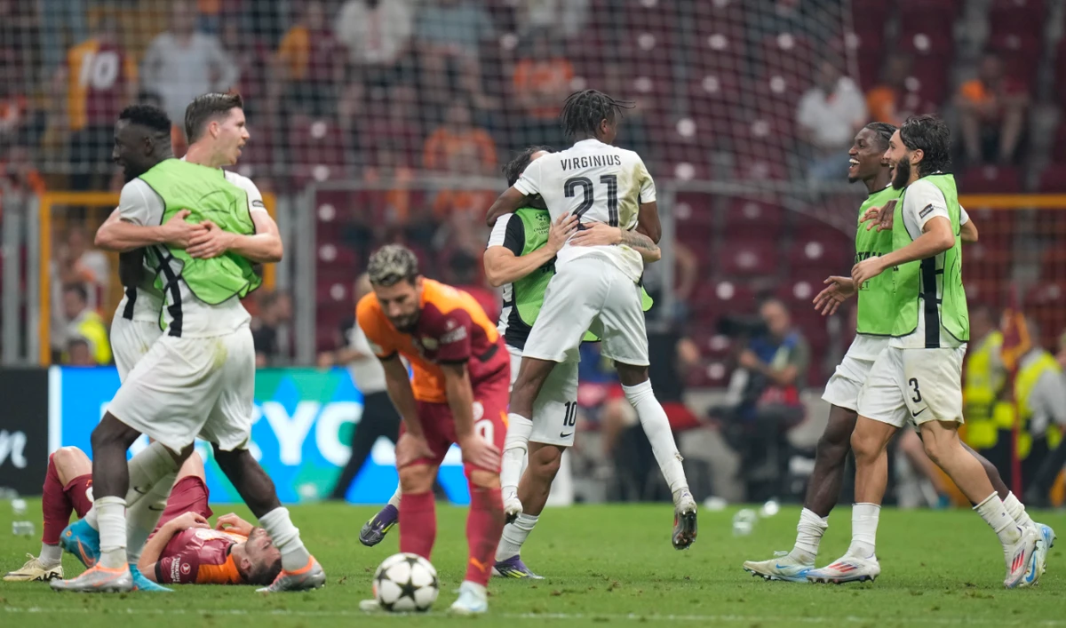 Young Boys players celebrate victory at the end of the Champions League playoff second leg soccer match between Galatasaray and Young Boys in Istanbul Tuesday. (AP)