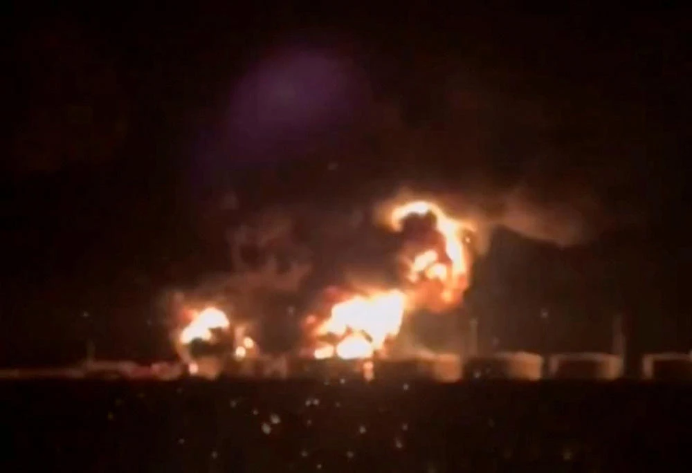 Above, a screen grab from a social media video released on Aug. 28, 2024 shows fire in the oil tanks at the Glubokinskaya oil depot at Kamensky district, Rostov Region, Russia. (via Reuters)