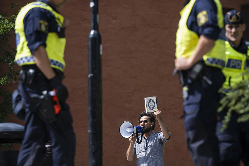 Salwan Momika, a Christian Iraqi, protests outside a mosque in Stockholm on June 28, 2023. (AFP)