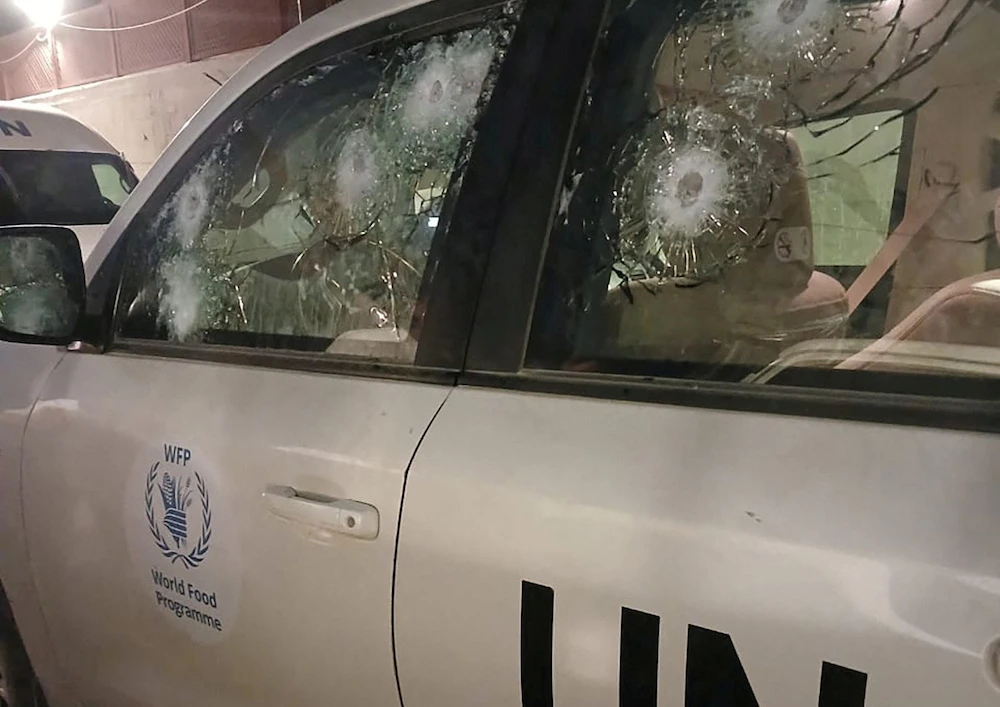 Impacts on a World Food Programme’s bullet-proof windows are seen after the UN agency said the vehicle came under fire a few meters from an Israeli check point at the Wadi Gaza bridge in Al-Mughraqa, Gaza Strip (Reuters)